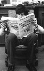 John reading the day's paper